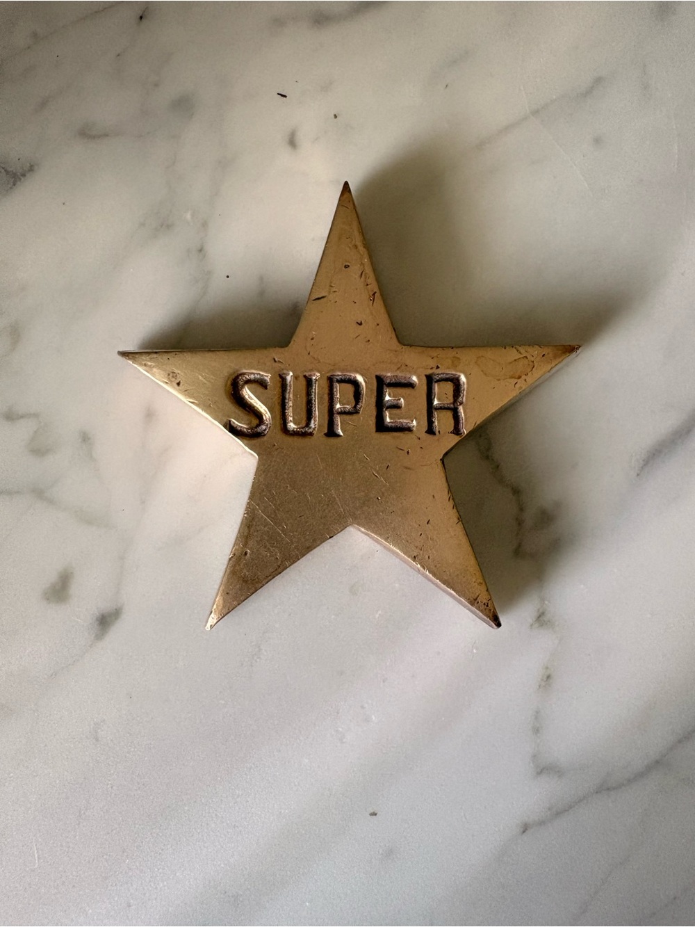 Vintage Brass Star Paperweight with 'SUPER' Embossed